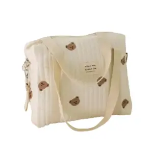 Baby bag, which can be worn on the shoulder, on the hand or on the stroller, ivory white with teddy bear embroidery